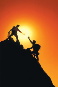 mountain-climbers-reaching-summit