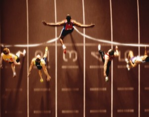 Athletics, runners at finish line, overhead view (Digital Composite)