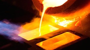 Molten-gold-pours-from-a-crucible-into-a-heated-mold-after-refining-at-the-Kaloti-Jewellery-LLC-factory-in-Sharjah-United-Arab-Emirates.